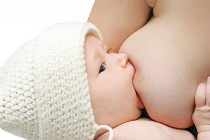 Newborn baby breast feeding, a Photo by saiko3p