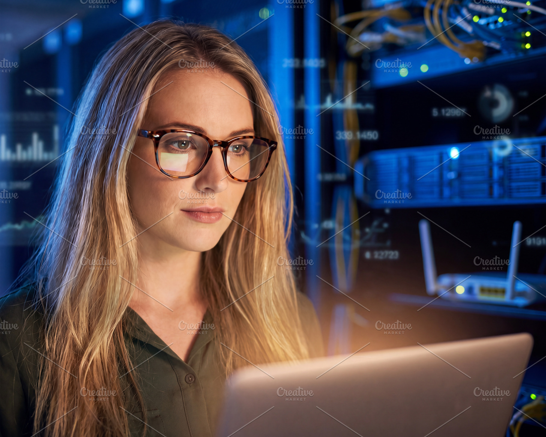 Professional female IT engineer (blonde woman in glasses) workin, a Technology Photo by Volff