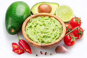 Guacamole bowl and guacamole ingredients isolated on white backg, a Food & Drink Photo by Volff