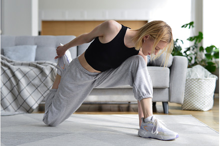 Woman doing stretching exercise at, a Sports & Recreation Photo by undrey
