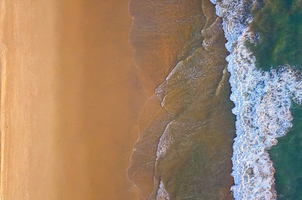 Aerial view of beach with waves roll stock photo containing aerial and top, a Nature Photo by Tampatra