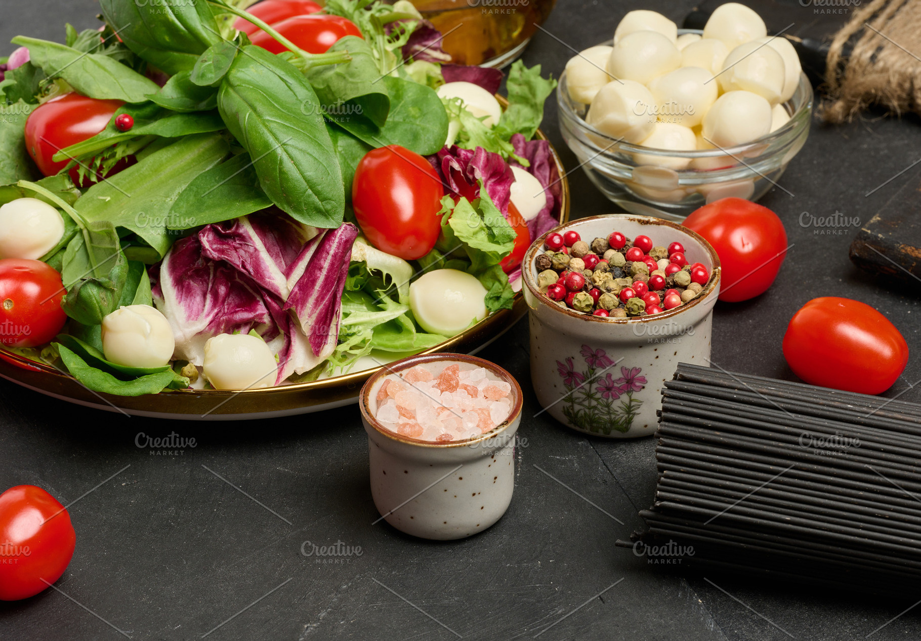 A plate of fresh salad with mixed greens, cherry tomatoes and mo, a Food & Drink Photo by ndanko