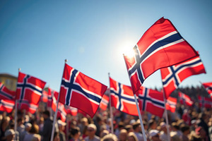 Norwegian flags fluttering energetically against bright sky, commemorating Nati, a Holiday Photo by Antonio Gravante Market