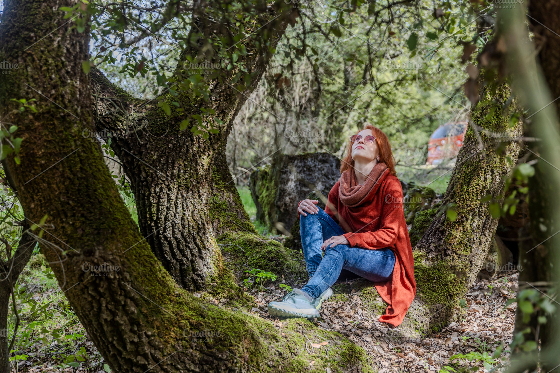 Dreamy redhead woman sitting on a th, a Person Photo by Imaginarium