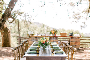 Outdoor table setting under trees