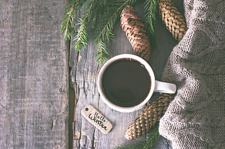 Coffee cones cozy knitted blanket containing marshmallow, hot, and cocoa