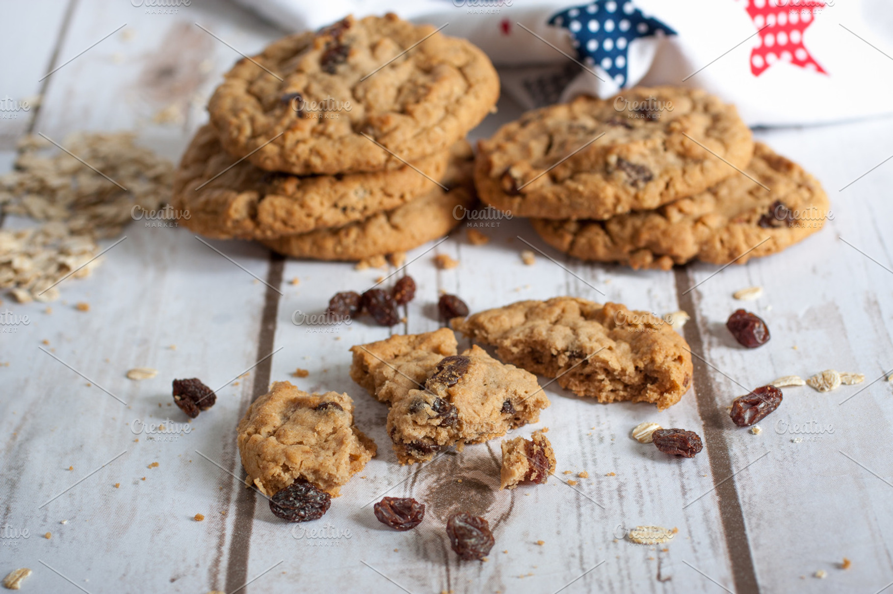 Fresh oatmeal raisin cookies stock photo containing baked and board, a Food & Drink Photo by Southern Light