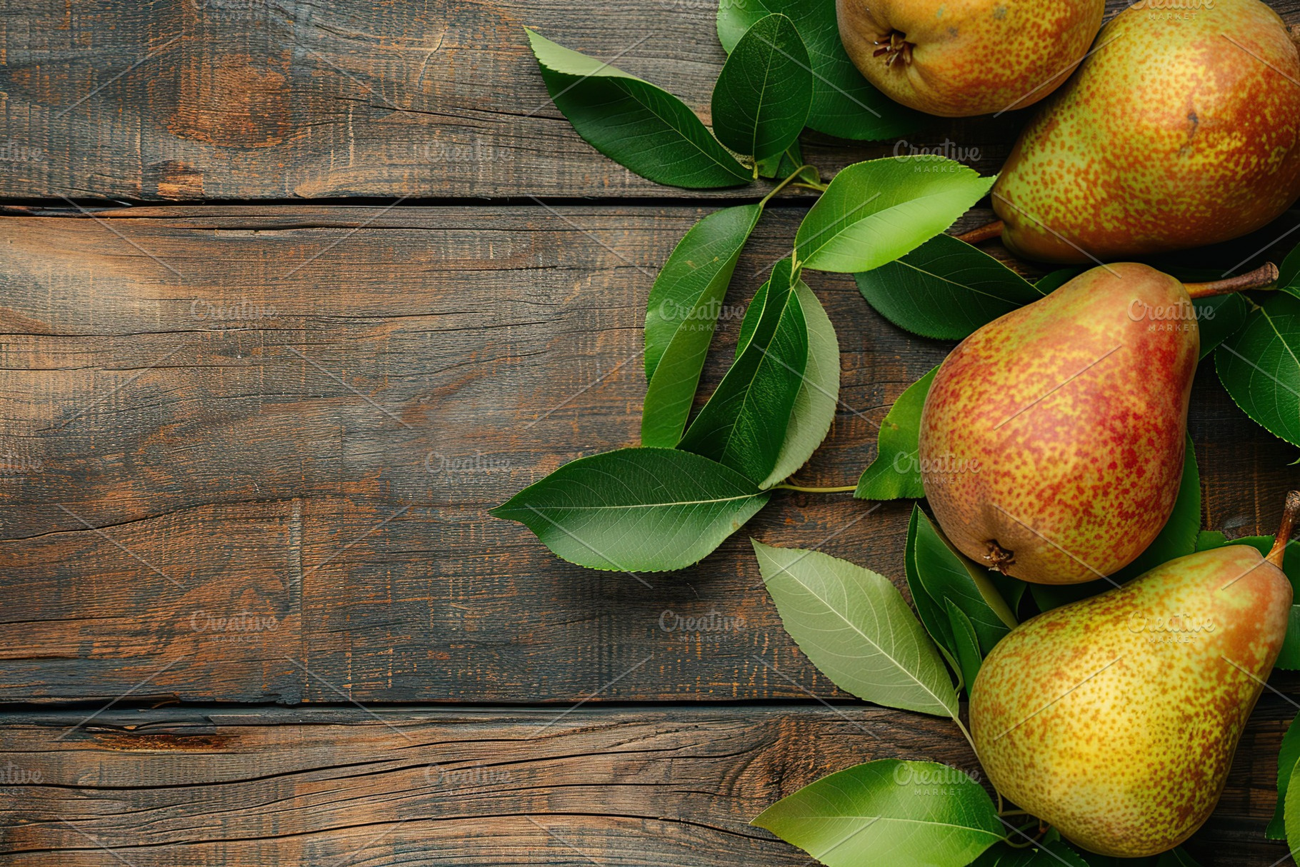Red pears with leafs and copyspace for text on wooden table, a Food & Drink Photo by AlyaAnd