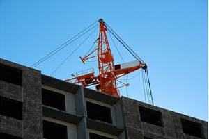 Construction cranes lift materials, an Industrial Photo by darksoul72