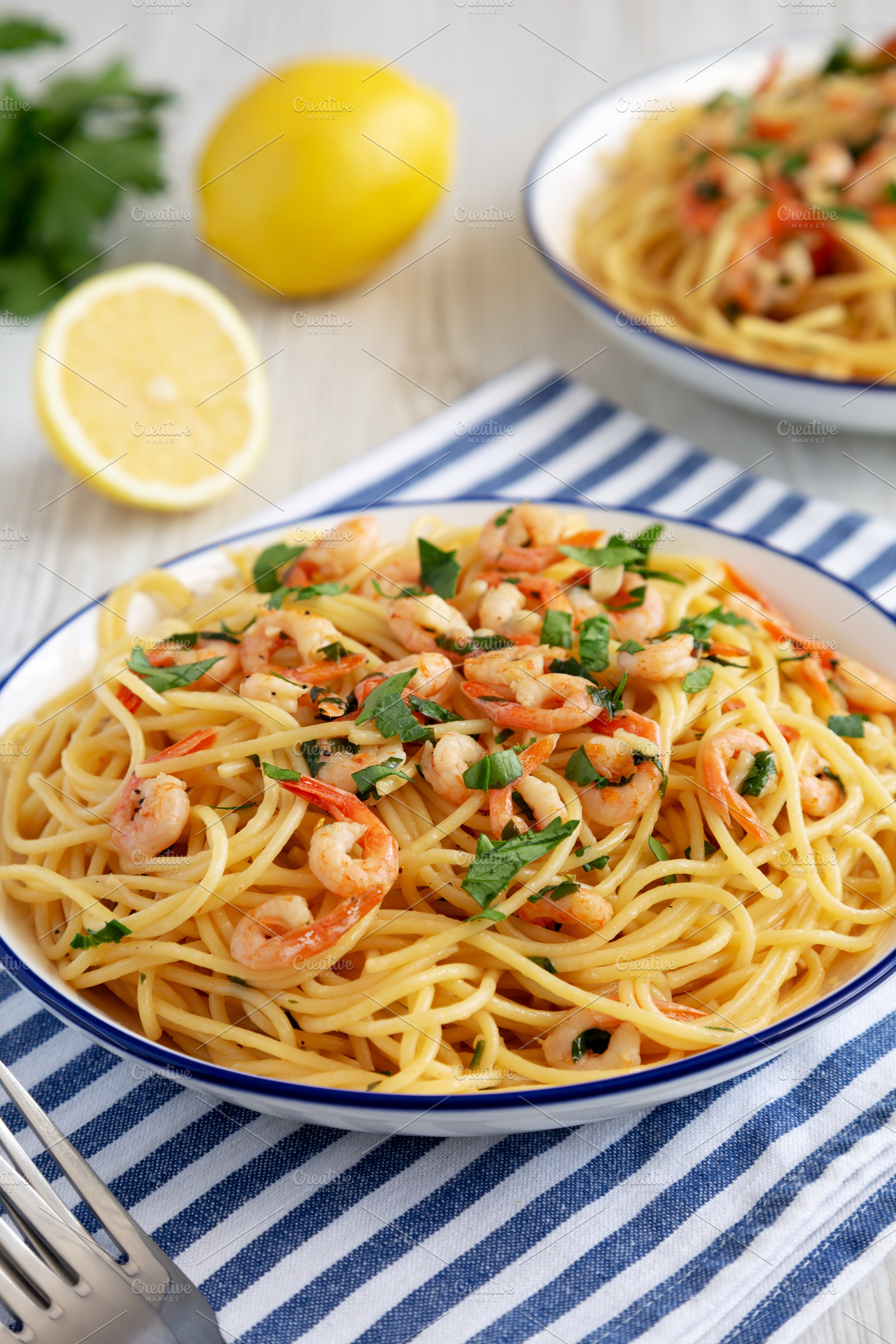 Homemade Garlic Shrimp Scampi with Parsley on a Plate, low angle, a Food & Drink Photo by LiudmylaChuhunova