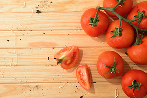 Fresh Tomatoes with Slices on Wooden Background, a Food & Drink Photo by Davizro's Market