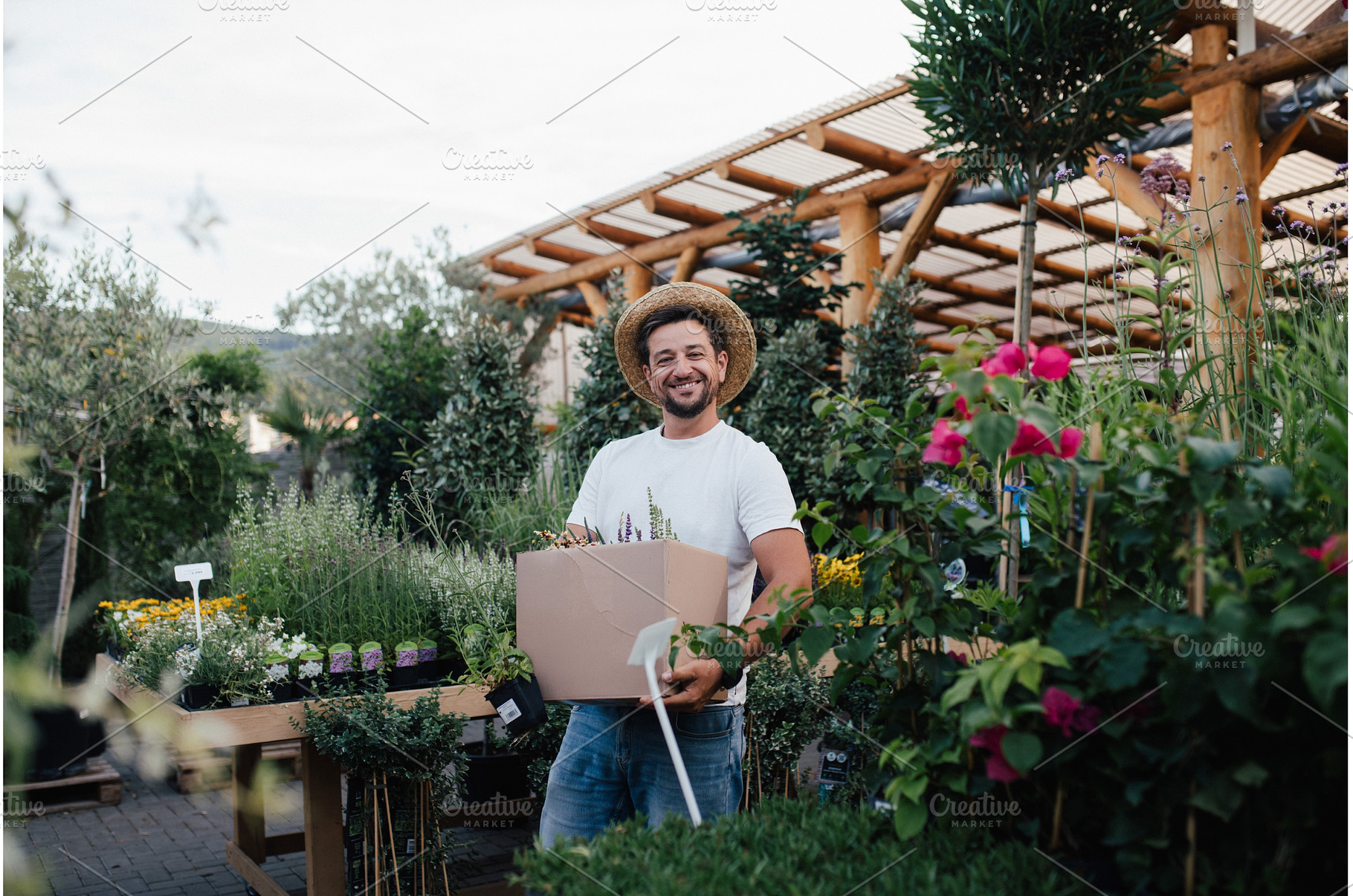 Customer carrying flower box at, a Person Photo by HalfPoint