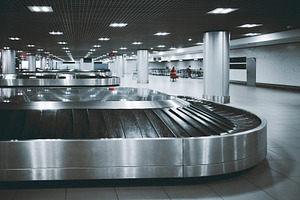 Empty airport baggage claim carousel, a Transportation Photo by SkyNext