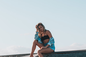 Young woman at skatepark containing blonde, hair, and skate