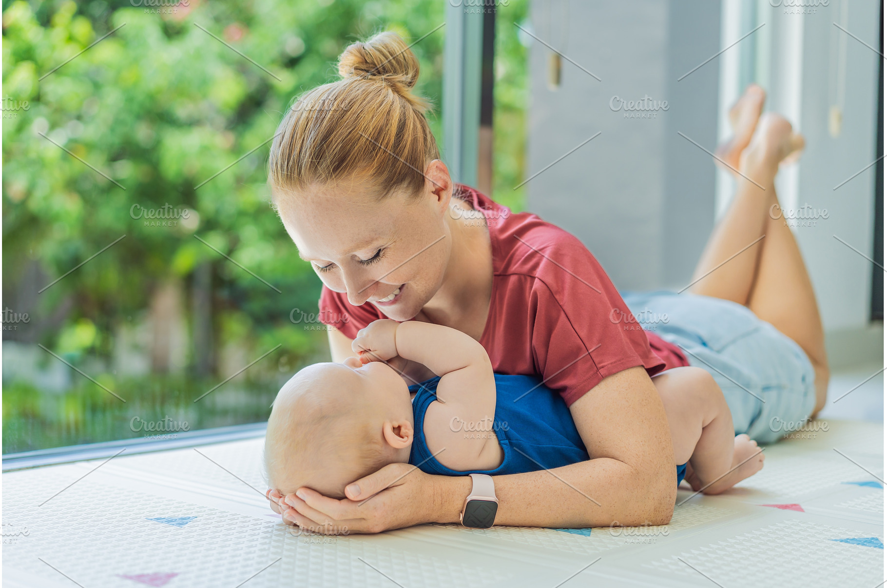 Mother and baby lying on a soft play, a Person Photo by Elizaveta Galitskaya