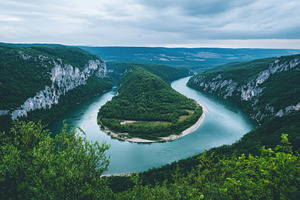 Stunning river winding through lush, a Photo by Tanuart