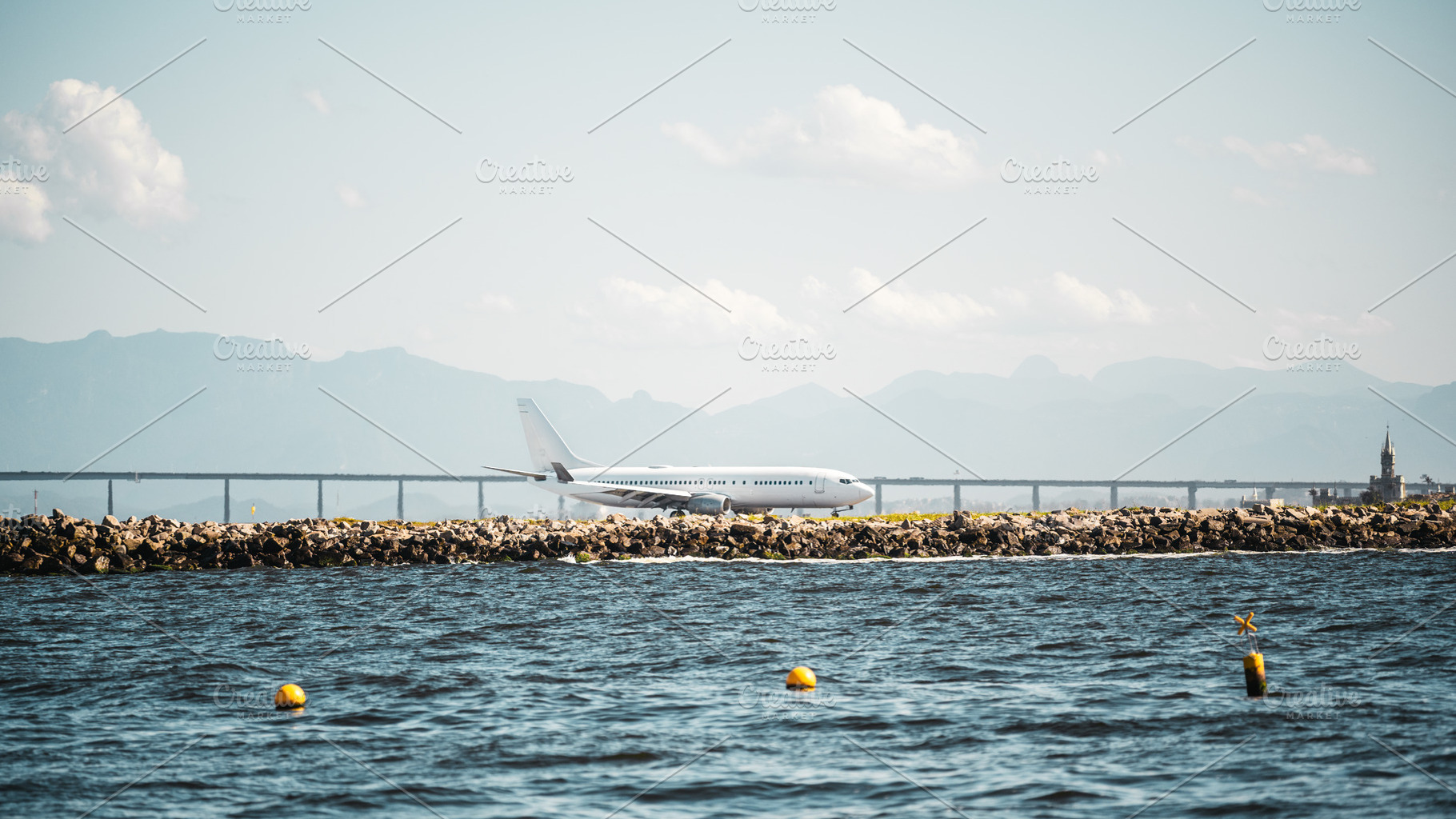 Airplane by coast in telephoto view, a Transportation Photo by SkyNext