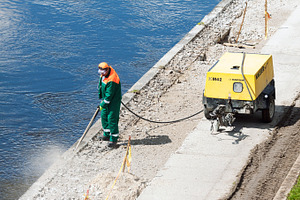 Construction worker at work, a Person Photo by BOOCYS