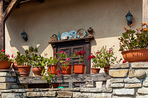 Rustic terrace with potted flowers and vintage decor, a Nature Photo by Photostock