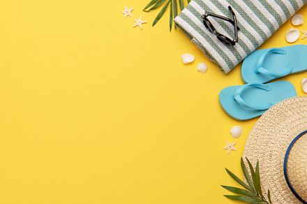 Summer holiday beach background with beach accessories and tropi