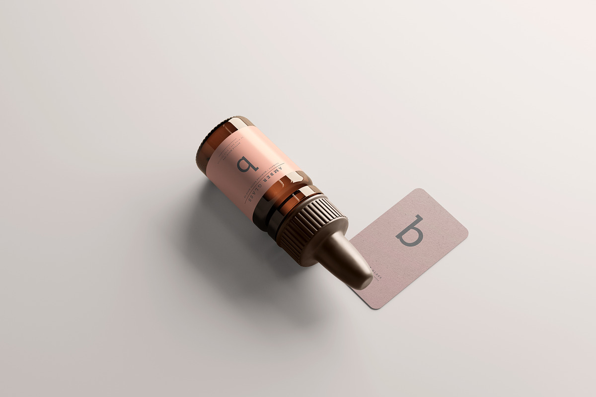 Amber Glass Dropper Bottle Mockups, a Cups & Container Mockup by pmvch (Photo 16 of 20)