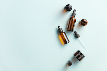 Amber glass cosmetic bottles mockups on blue background. Natural, a Beauty & Fashion Photo by Natalia Klenova's Shop