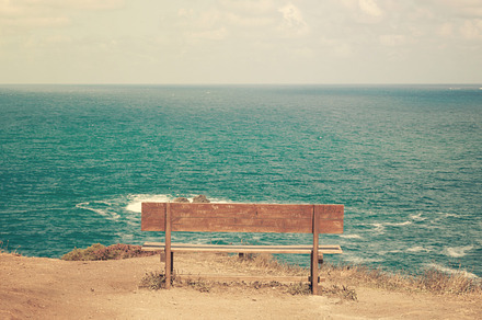 Alone stock photo containing bench and cliff