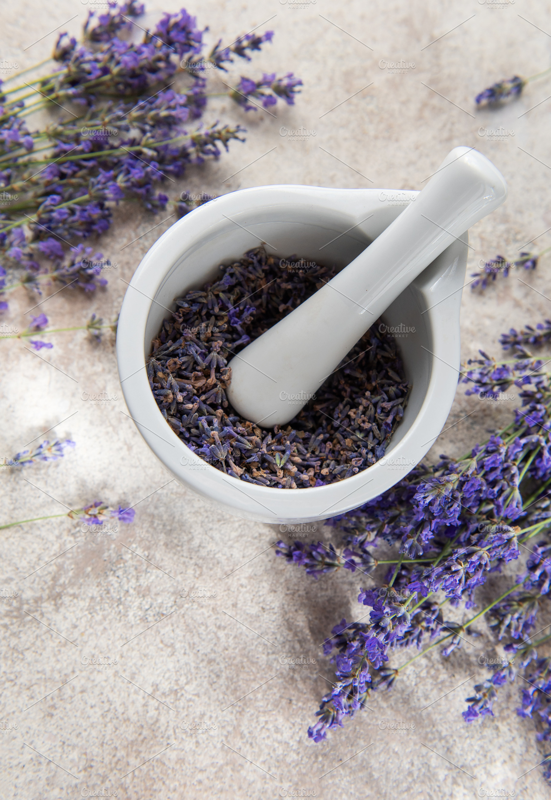 Lavender flowers and mortar with pestle for aromatherapy, a Health & Medical Photo by Olena Rudo