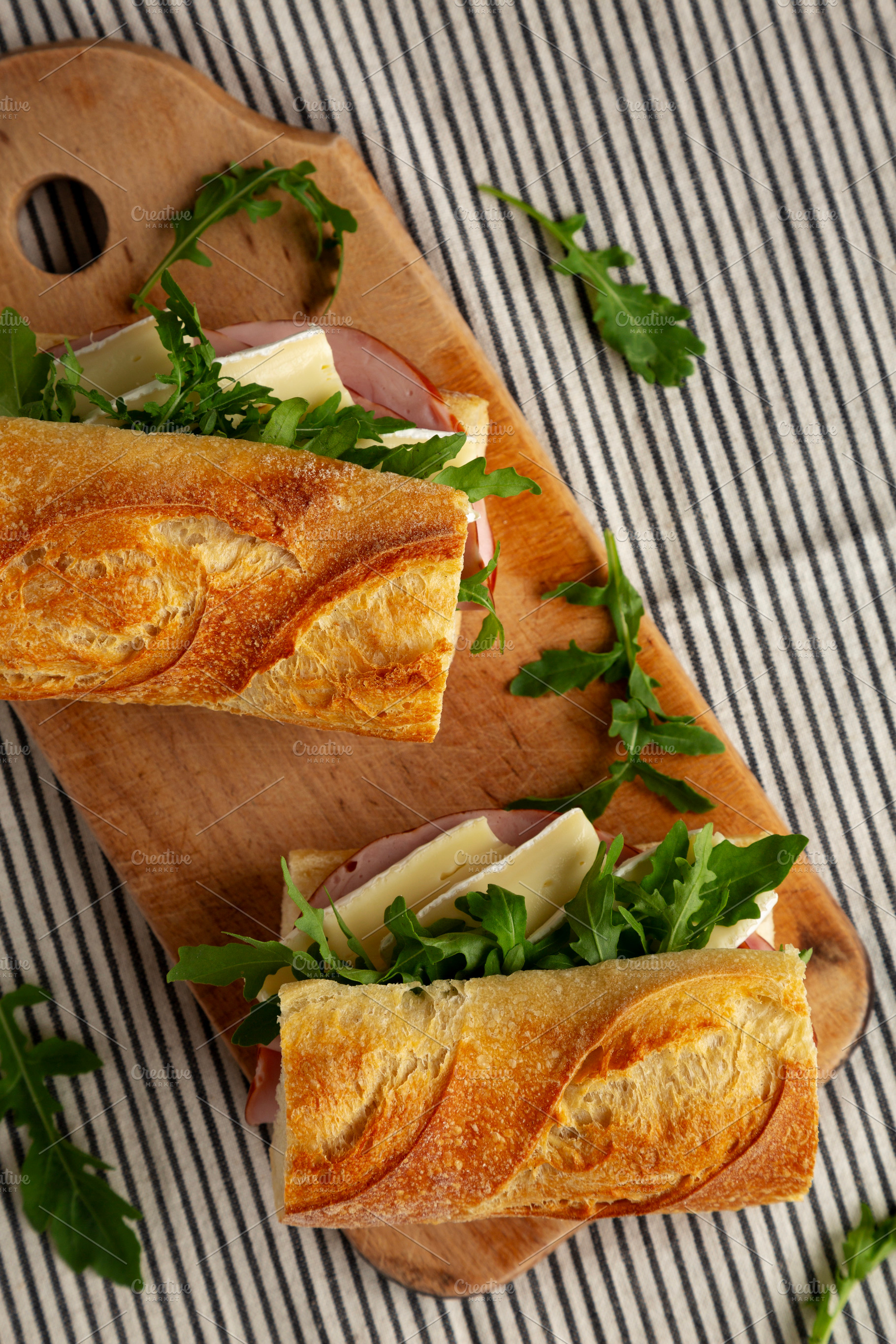 Homemade French Ham and Brie Baguette with Arugula Greens, top v, a Food & Drink Photo by LiudmylaChuhunova