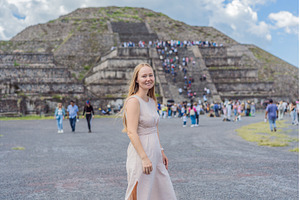 Female tourist standing in front of, a Person Photo by Elizaveta Galitskaya