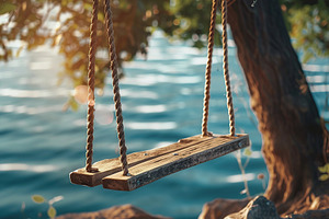 Wooden swing with rope on river background, a Nature Photo by AlyaAnd