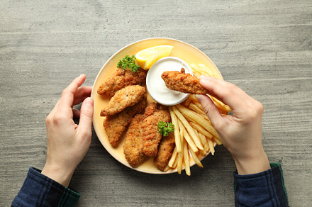 Concept of tasty food with chicken strips, top view, a Food & Drink Photo by AtlasStudio PRO