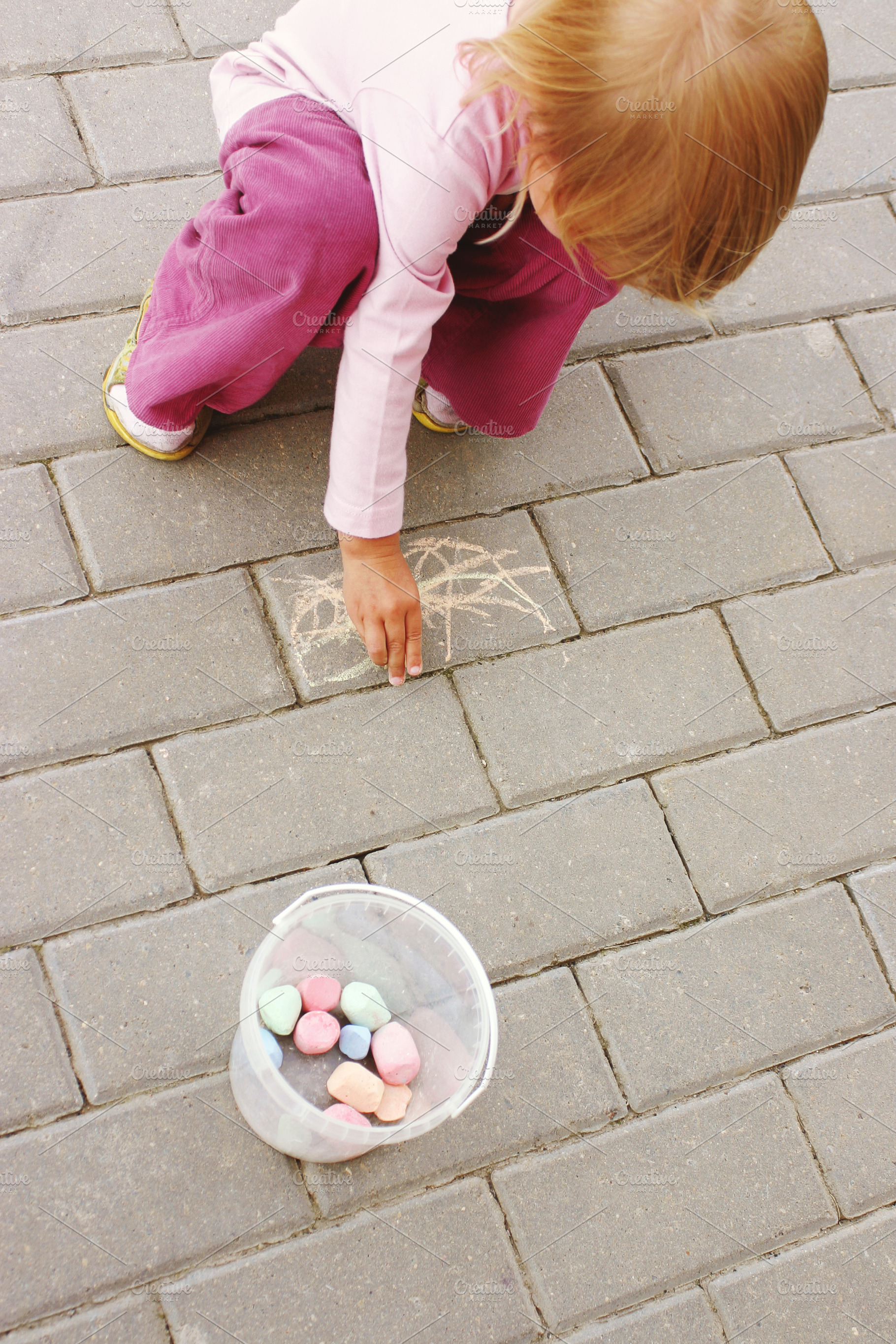 Little girl drawing with crayon, a Person Photo by BOOCYS
