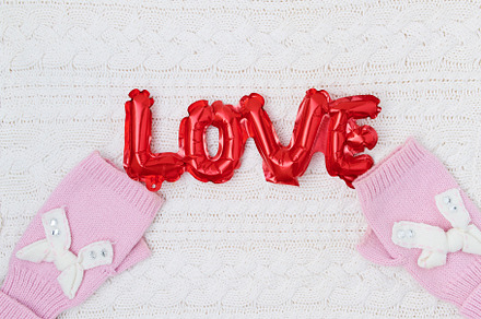 winter flat lay with love inscription and mittens, a Holiday Photo by Alliance Images