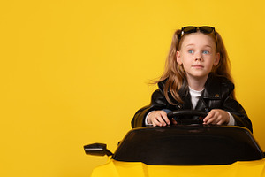 Young girl in black leather jacket and sunglasses on head sittin, a Person Photo by Ales Munt