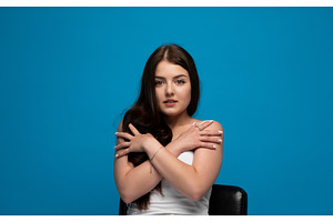 Young woman embracing herself with, a Person Photo by volodymyrshtun13795