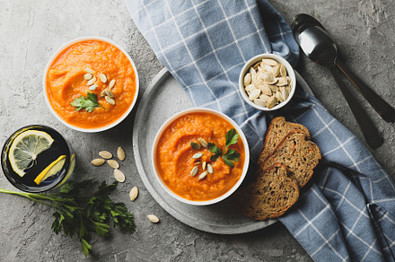 Composition with pumpkin soup on gray background, top view, a Food & Drink Photo by AtlasStudio PRO