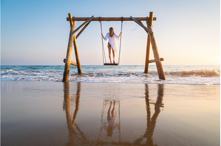Happy young woman on wooden swing in, a Person Photo by den-belitsky