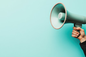 Calling attention with a megaphone, a Photo by Beautiful things