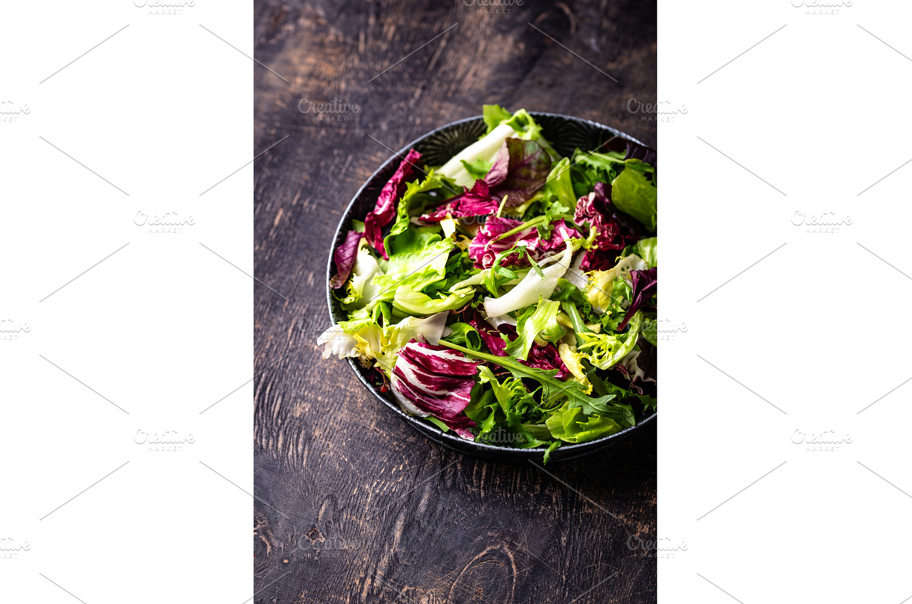 Bowl of fresh green salad mix, a Food & Drink Photo by Yulia Furman