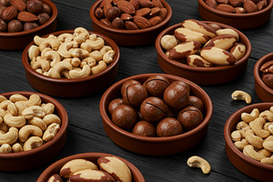 Assorted mixed nuts in rustic clay b, a Food & Drink Photo by professorinc