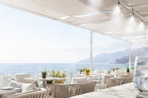 Outdoor beachfront dining area with, a Photo by Dvoevnore photos