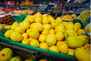 Lemons are piled high in a green, a Food & Drink Photo by darksoul72