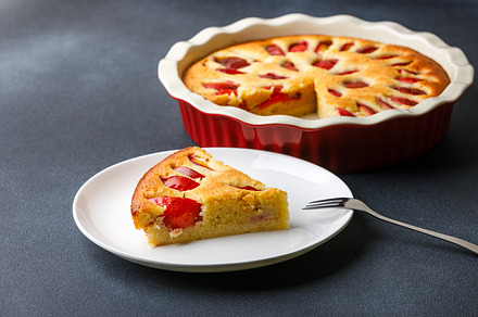 Homemade plum pie with almond flour with a piece served on plate, a Food & Drink Photo by serkum