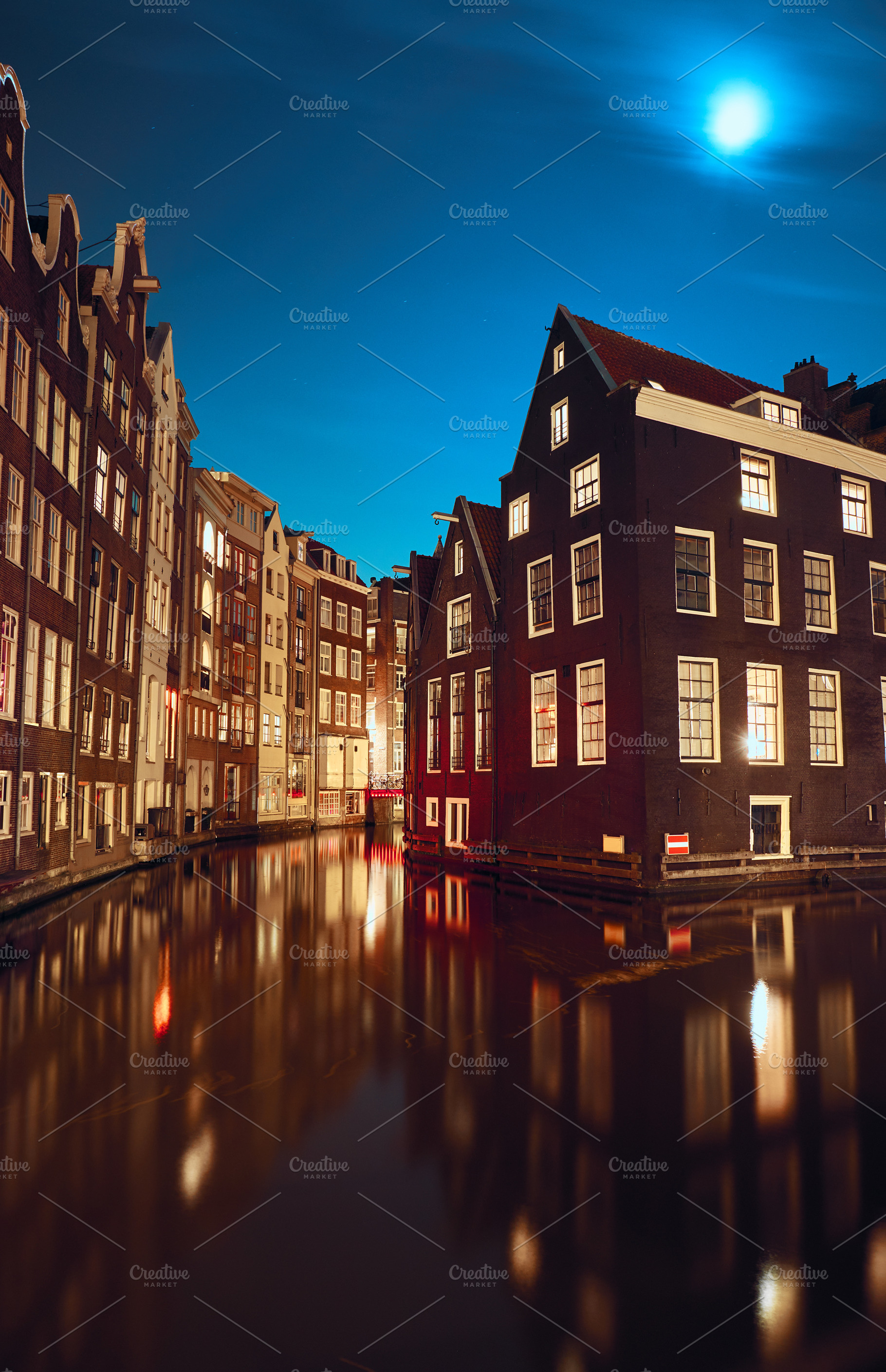 Canal and buildings in Amsterdam, a Background Photo by badahos