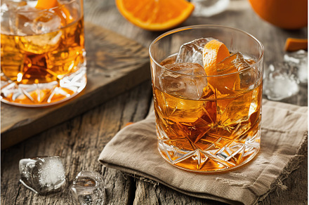 Crystal glass of whiskey with ice on, a Food & Drink Photo by Lermont51