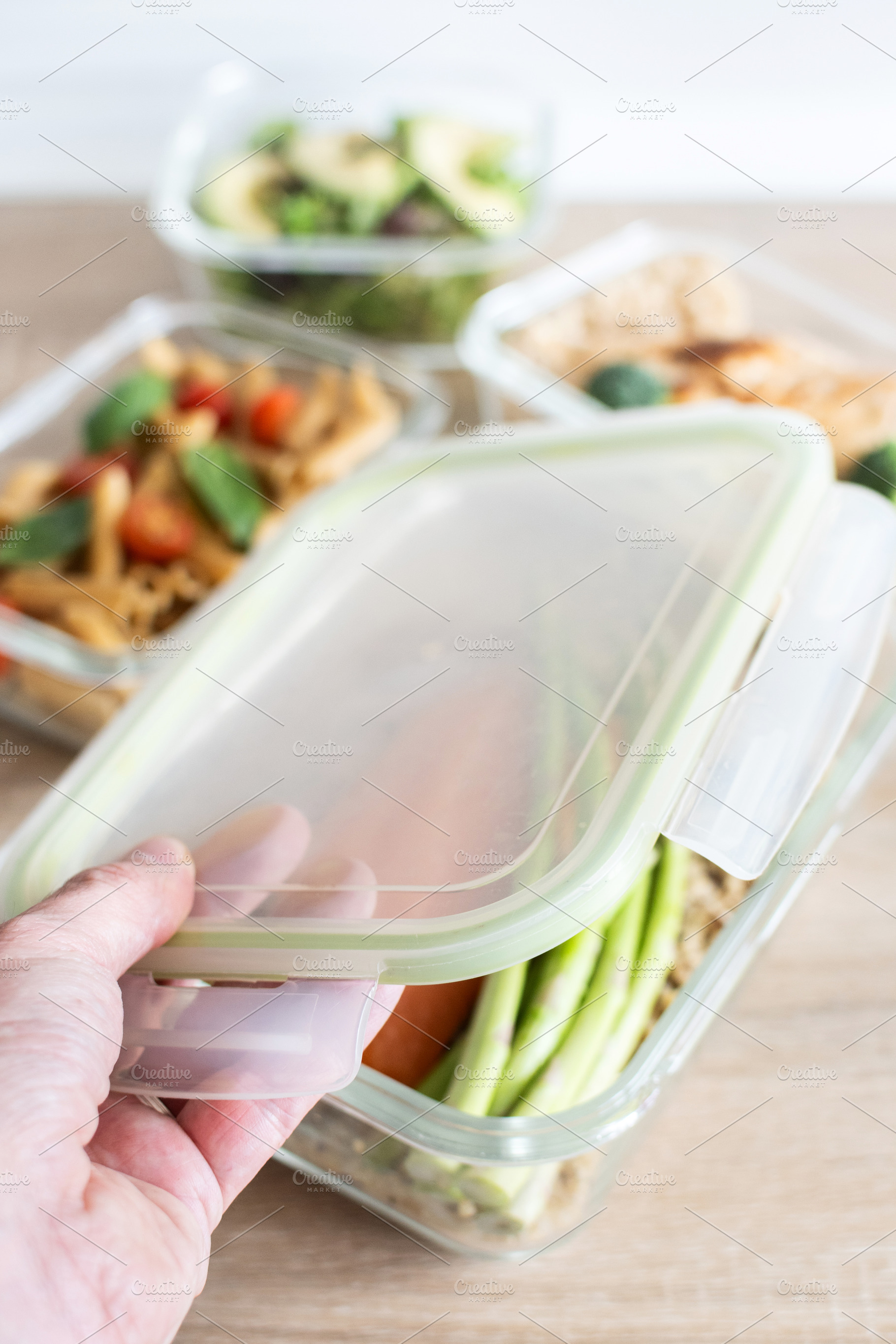 Closing Healthy Meal Prep Container with Salmon and Vegetables, a Food & Drink Photo by etorres69