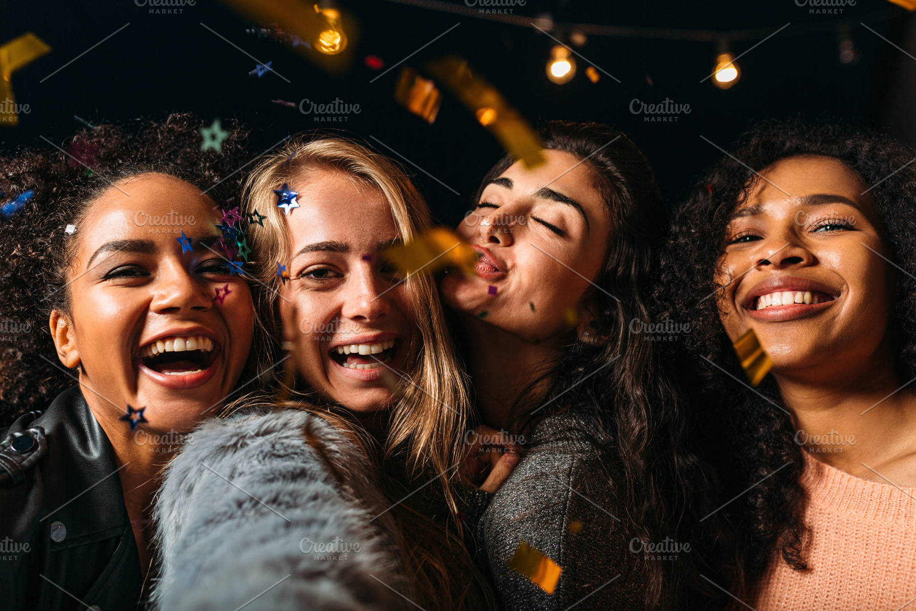 Four laughing girls taking selfie, a Person Photo by Artem Varnitsin