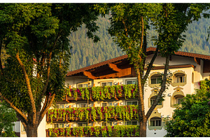 Flower strewn balconies of a hotel, an Architecture Photo by Backyard Stock