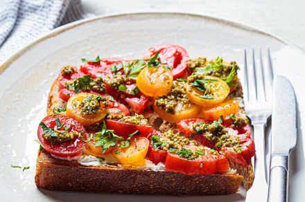 Toast with tomato, pesto and cheese, a Food & Drink Photo by vaaseenaa